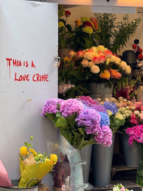 A display of fresh flower bouquets and arrangements at Bethnal Green Florist, including pink and purple hydrangeas in a clear plastic-wrapped bouquet, alongside other flowers such as roses and chrysan